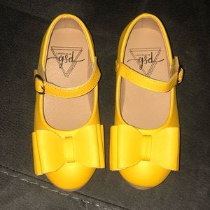Yellow bow shoes